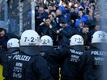 Schalke's supporters face police officers after the German First division Bundesliga football match BVB Borussia Dortmund v Schalke 04 in Dortmund, western Germany on April 27, 2019. (Photo by INA FAS