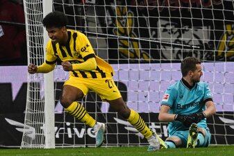 Dortmunds Karim Adeyemi feiert seinen Treffer gegen Leverkusen. Dortmunds Karim Adeyemi feiert seinen Treffer gegen Leverkusen.