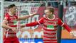 Augsburgs Torschütze Arne Maier (r) und Emirdan Demirovic jubeln über den Treffer zum 2:1.