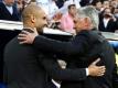 Bayern-Coach Carlo Ancelotti (r) und ManCity-Trainer Pep Guardiola treffen in München aufeinander. Foto: Javier Lizon