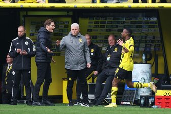 DORTMUND, GERMANY - APRIL 08: Youssoufa Moukoko of Borussia Dortmund celebrates with Edin Terzic, Head Coach of Borussia Dortmund, after scoring their sides second goal during the Bundesliga match bet DORTMUND, GERMANY - APRIL 08: Youssoufa Moukoko of Borussia Dortmund celebrates with Edin Terzic, Head Coach of Borussia Dortmund, after scoring their sides second goal during the Bundesliga match bet