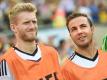 André Schürrle (l) und Mario Götze spielen jetzt gemeinsam beim BVB. Foto: Andreas Gebert