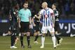 BERLIN, GERMANY - FEBRUARY 03: Toni Leistner of Hertha Berlin talks to the referee Daniel Schlager as the game is interrupted during a fan protest with tennis balls during the Second Bundesliga match 