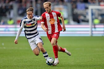 DUISBURG, GERMANY - OCTOBER 28: (L - R) Caspar Jander of Duisburg challenges Lucas Brumme of Essen during the 3. Liga match between MSV Duisburg and Rot-Weiss Essen at Schauinsland-Reisen-Arena on Oct DUISBURG, GERMANY - OCTOBER 28: (L - R) Caspar Jander of Duisburg challenges Lucas Brumme of Essen during the 3. Liga match between MSV Duisburg and Rot-Weiss Essen at Schauinsland-Reisen-Arena on Oct
