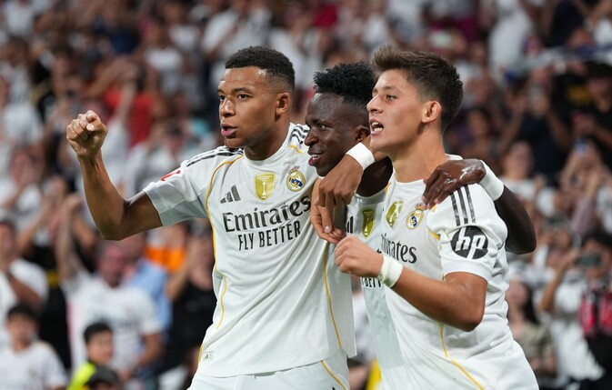 MADRID, SPAIN - AUGUST 30: Vinicius Junior of Real Madrid celebrates scoring his team's second goal with teammates Kylian Mbappe and Arda Gueler during the LaLiga EA Sports match between Real Madrid C