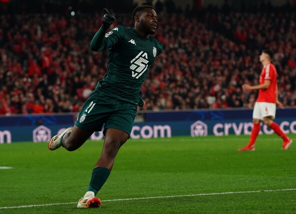 LISBON, PORTUGAL - FEBRUARY 18: George Ilenikhena of AS Monaco celebrates after scoring a goal during the UEFA Champions League 2024/25 League Knockout Play-off Second Leg match between SL Benfica and