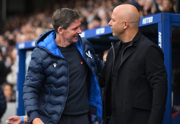 LONDON, ENGLAND - SEPTEMBER 27: Oliver Glasner, Manager of Crystal Palace, and Arne Slot, Manager of Liverpool, interact prior to the Premier League match between Crystal Palace and Liverpool at Selhu