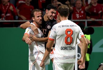 WIESBADEN, GERMANY - AUGUST 27: Harry Kane of Bayern Munich celebrates scoring his team's third goal with teammates Aleksandar Pavlovic and Leon Goretzka during the DFB Cup match between SV Wehen Wies WIESBADEN, GERMANY - AUGUST 27: Harry Kane of Bayern Munich celebrates scoring his team's third goal with teammates Aleksandar Pavlovic and Leon Goretzka during the DFB Cup match between SV Wehen Wies