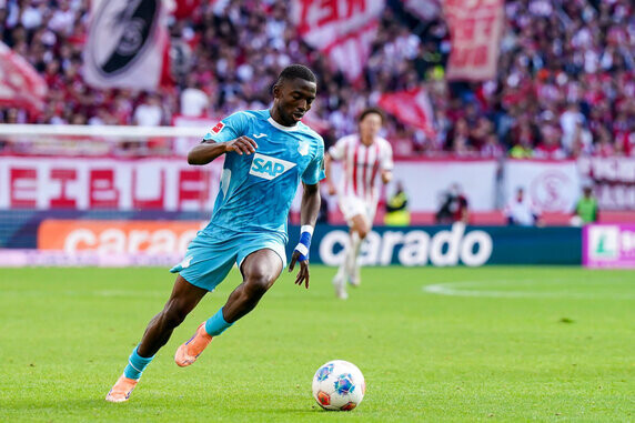 FREIBURG IM BREISGAU, GERMANY - SEPTEMBER 28: Bazoumana Toure of Hoffmann controls the ball during the Bundesliga match between SC Freiburg and TSG Hoffenheim at Europa-Park Stadion on September 28, 2