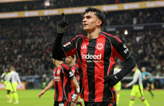 FRANKFURT AM MAIN, GERMANY - JANUARY 09: Can Uzun of Eintracht Frankfurt celebrates scoring his team's first goal from the penalty spot during the Bundesliga match between Eintracht Frankfurt and Boru