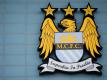 Das Emblem vom englischen Fußball-Club Manchester City. Foto: Sven Hoppe