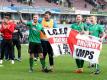 Die Spieler von Lincoln City jubeln über ihren Sieg im FA Cup. Foto: Martin Rickett