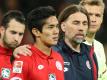 Enttäuschung beim Mainzer Team um Trainer Martin Schmidt (2.v.r.). Der große Kampf gegen RB Leipzig wurde nicht belohnt. Foto: Thomas Frey