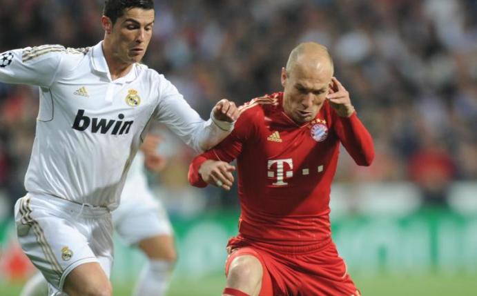 Münchens Arjen Robben (r) und Madrids Cristiano Ronaldo im Zweikampf. Das Duell zwischen dem deutschen und dem spanischen Rekordmeister steht vor seiner nächsten Auflage. Foto: Marc Müller