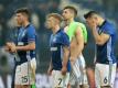 Schalkes Klaas-Jan Huntelaar (l-r), Max Meyer, Torwart Ralf Fährmann und Sead Kolasinac unmittelbar nach dem Aus im Viertelfinale der Europa League gegen Ajax Amsterdam. Foto: Ina Fassbender