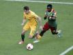 Australiens Robbie Kruse (l) im Spiel gegen Kamerun. Foto: Dmitri Lovetsky