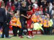 Jürgen Klopp (2.v.r) freut sich mit Mohamed Salah über den ersten Saisonsieg. Foto: Martin Rickett