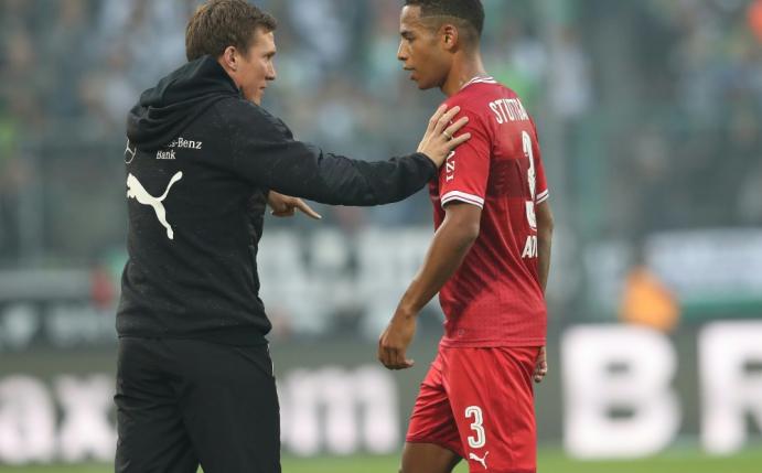 Trainer Wolf (l.) muss auf Aogo (r.) verzichten    