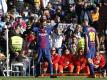 Superstar Lionel Messi (M) vom FC Barceloona feiert sein Tor gegen Real Madrid. Foto: Paul White