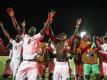 Ghanas Spieler feiern den Einzug ins Achtelfinale. Foto: Omar Zoheiry