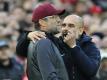 Treffen im englischen Supercup aufeinander: Jürgen Klopp (l) und Pep Guardiola. Foto: Rui Vieira/AP