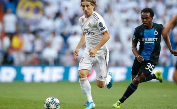 Luka Modric (l) und Real Madrid taten sich schwer gegen den FC Brügge. Foto: Bruno Fahy/BELGA/dpa