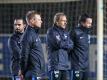 Herthas neuer Trainer-Stab: Co-Trainer Alexander Nouri (l-r), Co-Trainer Markus Feldhoff, Trainer Jürgen Klinsmann und Athletiktrainer Henrik Kuchno. Foto: Andreas Gora/dpa