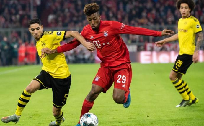 Achraf Hakimi (l) im Zweikampf mit Bayern-Profi Kingsley Coman. Foto: Matthias Balk/dpa