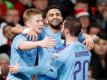 Riyad Mahrez (M) von Man City feiert mit seinen Teamkollegen Kevin De Bruyne (l) und Bernardo Silva den zweiten Treffer seines Teams. Foto: Martin Rickett/PA Wire/dpa