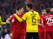 Treffen am Dienstag im Topspiel aufeinander: Bayern-Torjäger Robert Lewandowski (l) und BVB-Verteidiger Mats Hummels. Foto: Matthias Balk/dpa