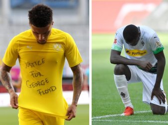 Jadon Sancho (l) trägt ein Trikot mit dem Schriftzug «Justice for George Floyd». Gladbachs Marcus Thuram kniet auf dem Rasen. Foto: Lars Baron/Getty Images Europe/Pool/dpa;Martin Meissner/AP Pool Jadon Sancho (l) trägt ein Trikot mit dem Schriftzug «Justice for George Floyd». Gladbachs Marcus Thuram kniet auf dem Rasen. Foto: Lars Baron/Getty Images Europe/Pool/dpa;Martin Meissner/AP Pool