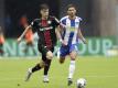 Leverkusens Kai Havertz (l) im Zweikampf mit Herthas Marko Grujic. Foto: Michael Sohn/AP/POOL/dpa