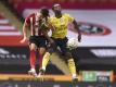 John Egan (l) von Sheffield United und Arsenal-Profi Eddie Nketiah im Kopfballduell. Foto: Oli Scarff/Pool AFP/dpa