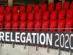 Der Schriftzug «Relegation 2020» ist an der leeren Tribüne angebracht. Foto: Tom Weller/dpa