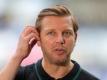 Bleibt Florian Kohfeldt Trainer des SV Werder Bremen. Foto: Friedemann Vogel/EPA/Pool/dpa