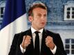Frankreichs Präsident Emmanuel Macron freut sich über den Erfolg von Olympique Lyon. Foto: Kay Nietfeld/dpa-Pool/dpa