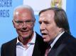Wurden 1974 gemeinsam Weltmeister im eigenen Land: Franz Beckenbauer (l)und Günter Netzer. Foto: Andreas Gebert/dpa