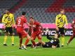 Joshua Kimmich (M) sorgte für den Bayern-Siegtreffer im Supercup gegen den BVB. Foto: Sven Hoppe/dpa-Pool/dpa