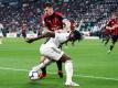 Moise Keane im Tikot von Juventus Turin (vorn) und Milans Alessio Romgnoli kämpfen um den Ball. Foto: Spada/Lapresse/Lapresse via ZUMA Press/dpa