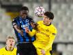 Odilon Kossounou vom FC Brügge und der Dortmunder Giovanni Reyna (r) im Kopfballduell. Foto: Bruno Fahy/BELGA/dpa