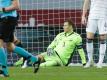 Von seinen Kollegen im Torwirbel der Spanier allein gelassen: Torhüter Manuel Neuer (M) sitzt nach dem 5:0 auf dem Boden. Foto: Daniel Gonzales Acuna/dpa