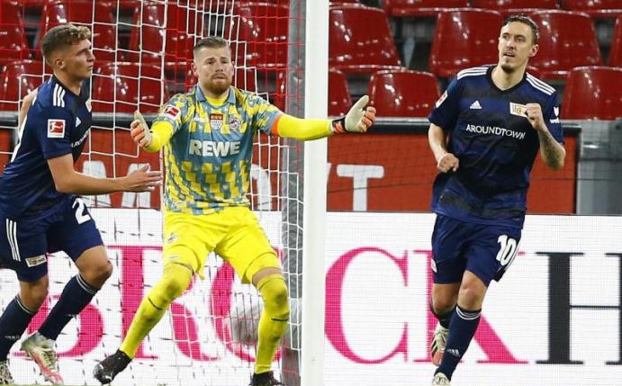 Max Kruse (r) machte den Union-Sieg in Köln perfekt. Foto: Thilo Schmuelgen/Reuters Images Europe/Pool/dpa