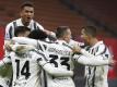 Juventus Turin feierte den Sieg im Spitzenspiel beim AC Mailand. Foto: Antonio Calanni/AP/dpa
