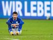 Enttäuscht sitzt Schalkes Nassim Boujellab nach der Partie auf dem Platz. S04 beendet die Hinrunde auf dem letzten Platz. Foto: Marius Becker/dpa