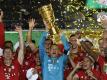 Manuel Neuer und Co. müssen den DFB-Pokal im Jahr 2021 auf alle Fälle abgeben. Foto: John Macdougall/AFP/POOL/dpa