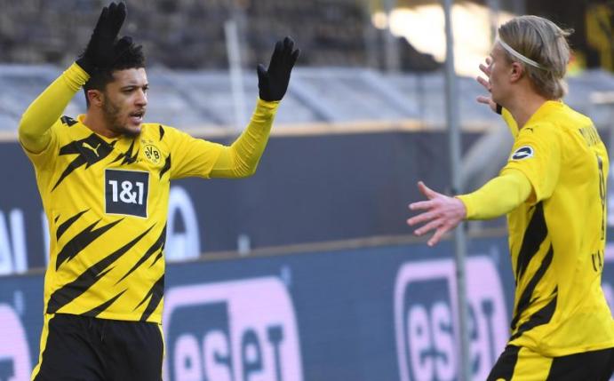 Jadon Sancho (l) und Erling Haaland retteten dem BVB einen Punkt gegen Hoffenheim. Foto: Marius Becker/dpa