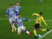 Jude Bellingham (r) steht bei Borussia Dortmund unter Vertrag. Foto: Friedemann Vogel/EPA-Pool/dpa