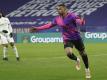 Traf beim PSG-Sieg in Lyon doppelt: Kylian Mbappé. Foto: Laurent Cipriani/AP/dpa