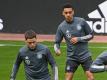 Florian Wirtz (l) und Jamal Musiala beim Training mit der Nationalmannschaft. Foto: Federico Gambarini/dpa