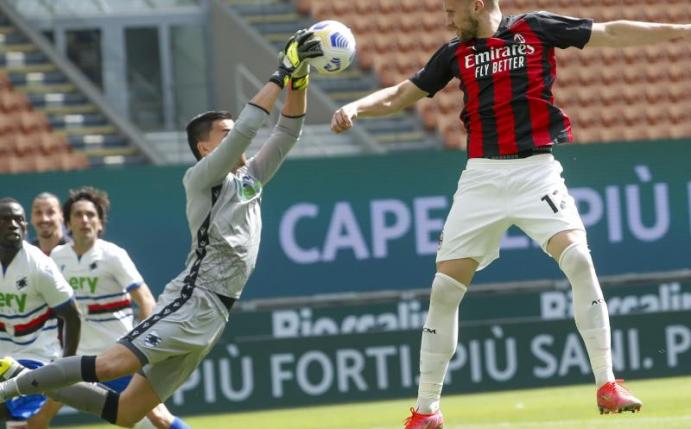 Genuas Torhüter Emil Audero wehrt einen Ball von Milans Ante Rebic (r) ab. Foto: Antonio Calanni/AP/dpa